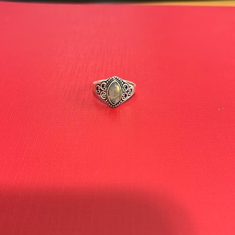 Woman’s size 7 silver and gray stone ring.